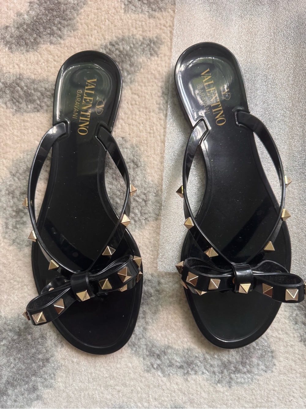 Valentino Garavani Black Jelly Sandals with Gold Rockstud Bows